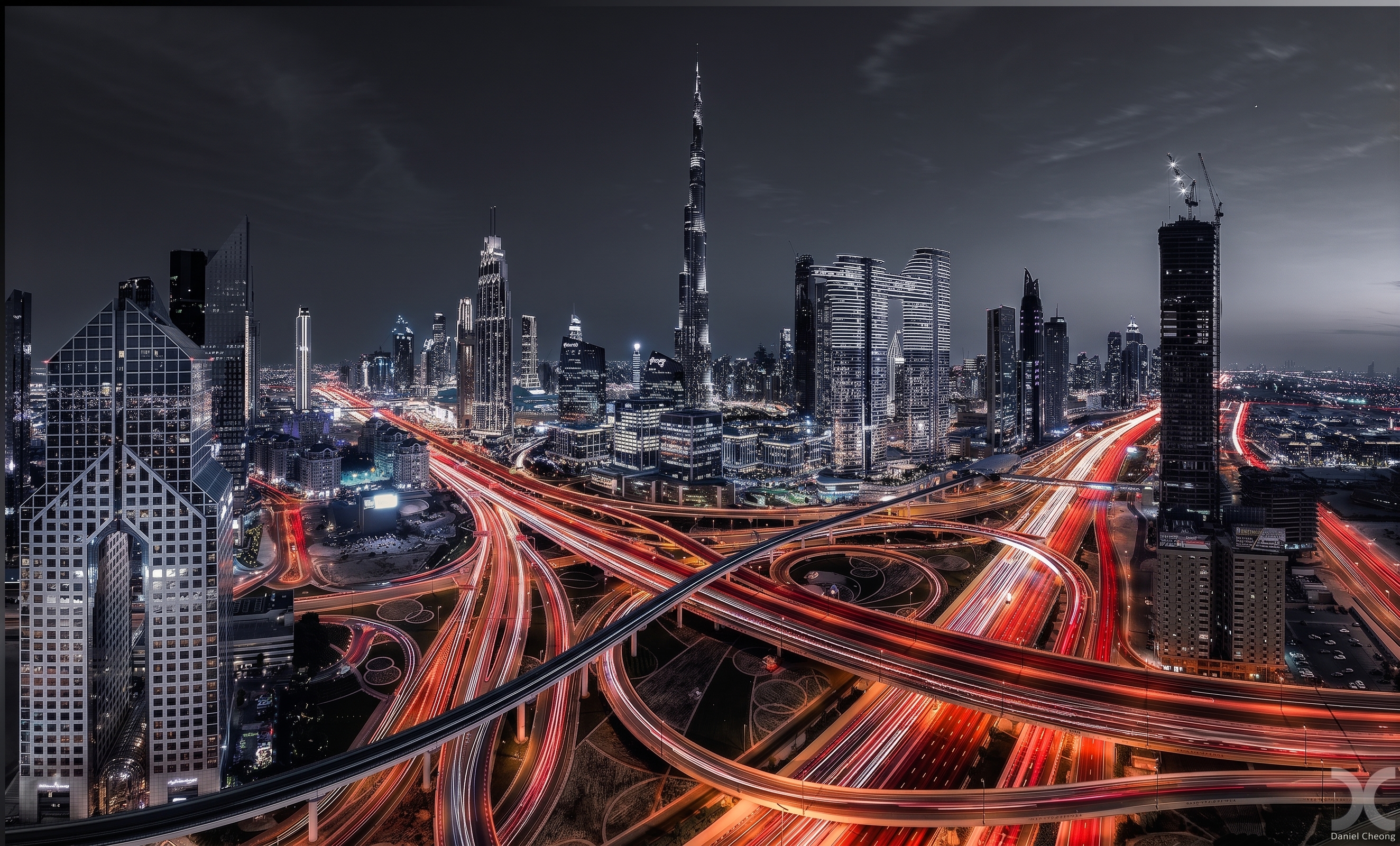 Dubai skyline at night with Sheikh Zayed Road light trails and the Burj Khalifa