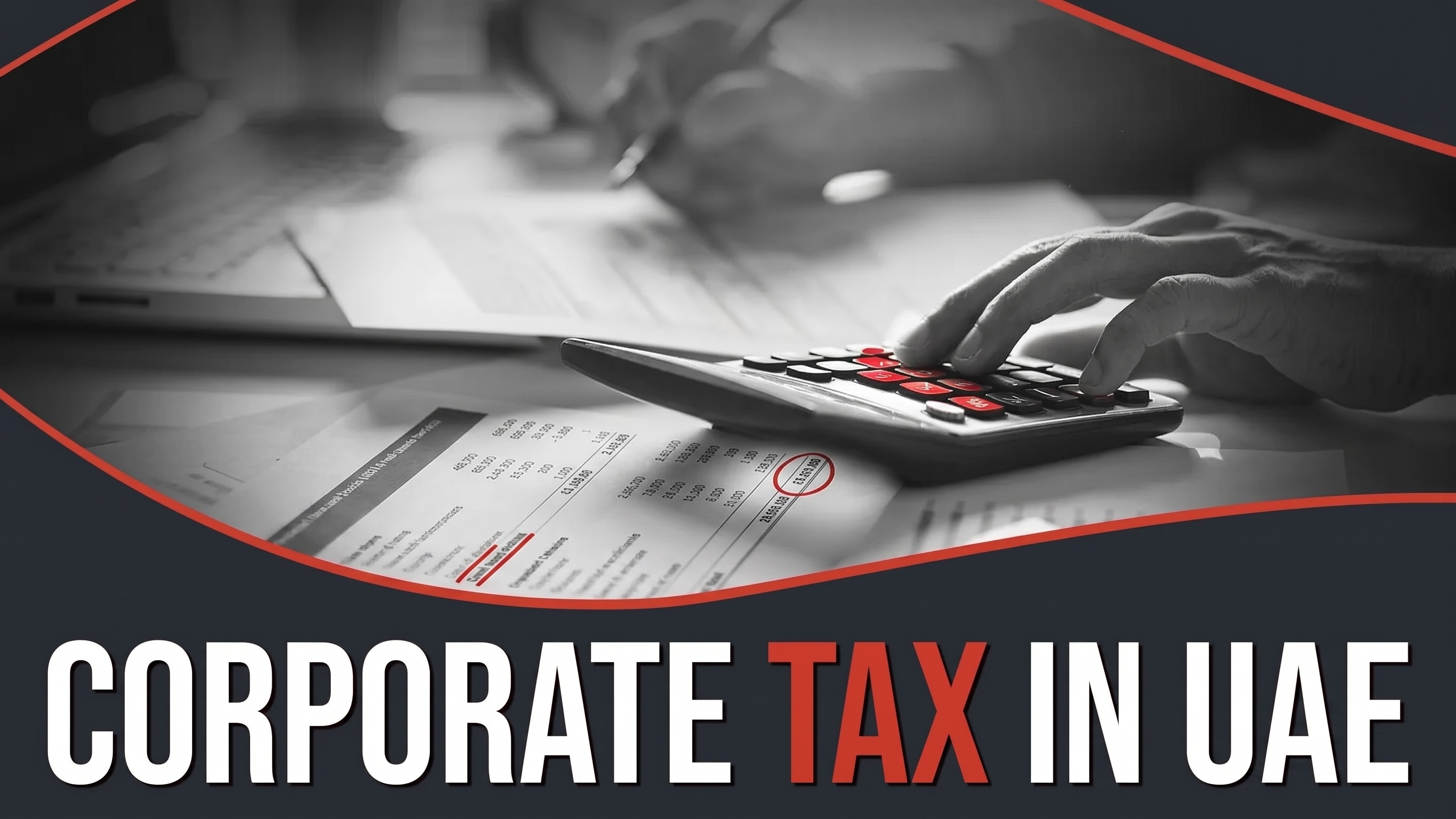 Corporate tax in UAE: a hand using a calculator over a printed tax computation